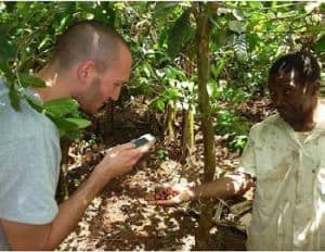 Picture of Aless andro Craparo registering coffee berries with smallholder farmers in Northern Tanzania.