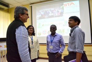 Picture of IITA scientists discussing about the YamBase platform.