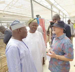 Picture of Chair of the Nigeria Zero Hunger Forum, Chief Obasanjo; Managing Director, Yintab Strategy Consults, Dr Babafemi Badejo, and Deputy Director General, Partnerships for Delivery, IITA, Dr Kenton Dashiell during a tour of facilities at the NZHF meeting in Borno.