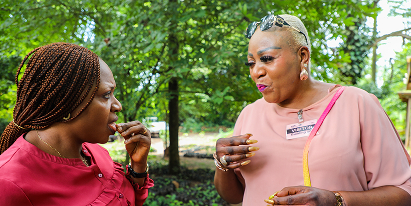 Stevens-Igbe and her colleague, Linda Godwin, Assistant Sustainability and CSR Manager, trying the miracle berry fruit at the Forest Center Nursery