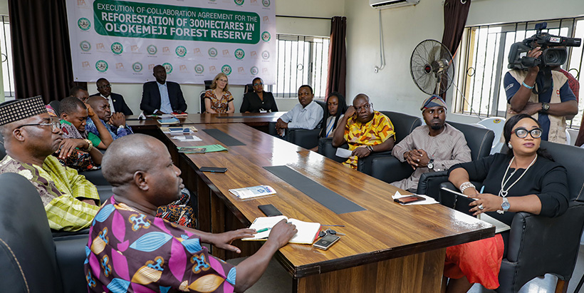 Attendees listening to a goodwill speech by a forestry ambassador at the MoU signing event.