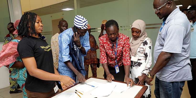 Adeola Ajayi facilitating a practical session with the participating farmers.