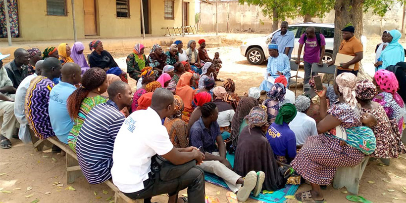 The MELSA team speaking with community members who participated in the Activity's interventions.