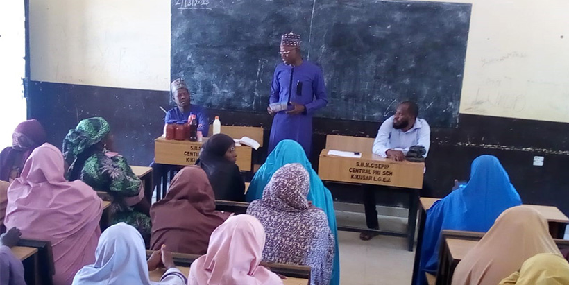  USAID MELSA team member, Professor John Jiya Musa, assessing the Tomapepo product (a mix of tomato, pepper, and onions) made by the Activity's beneficiaries in Kwaya Kusar LGA, Borno State.