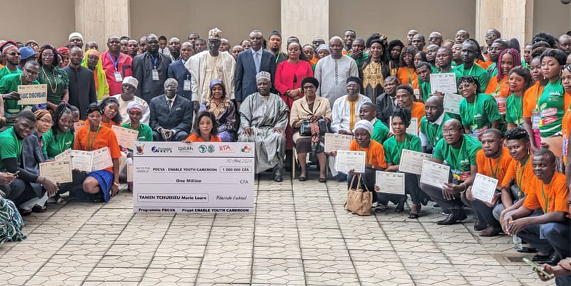 Members of government, graduates and guests posing with the 1 million FCFA cheque for personal project startup during EYC agripreneurs graduation on 30 April 2024.