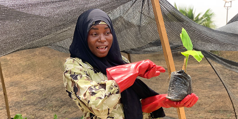 Azeezat in her banana nursery.