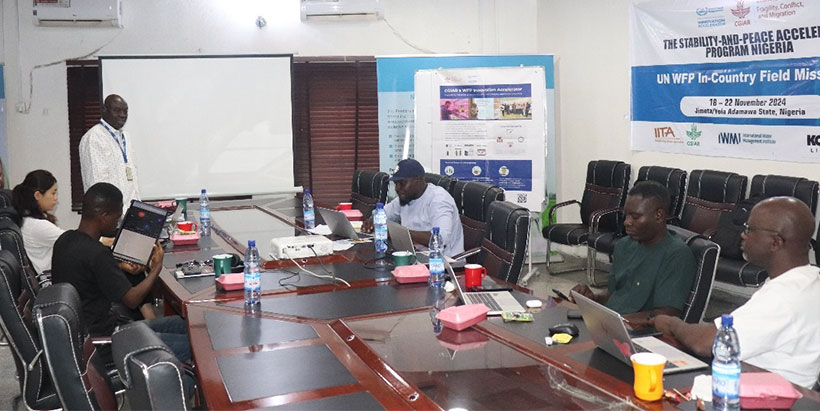 Mr Quadri Shakiru (standing) during his presentation at the session at the IITA Yola office.