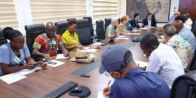 ACIAR delegates and IITA staff in an in-door meeting during their visit to IITA.