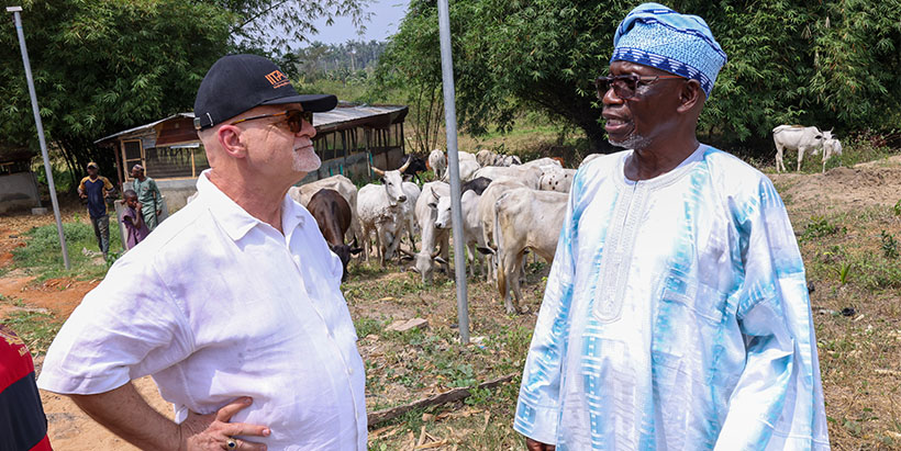 IITA-DDG P4D Kenton Dashiell with Aletheia University’s Chancellor and Founder, Major General S. A. Awosanya on a tour of the university's farm. 