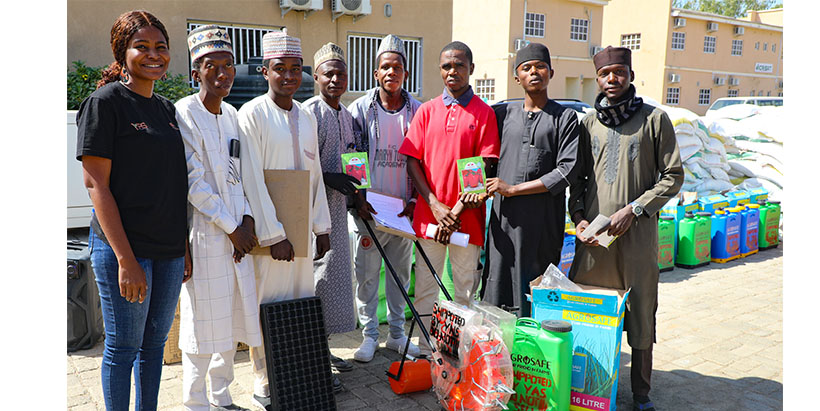 Planter machine, knapsack sprayer and other items being presented to horticultural farmers.