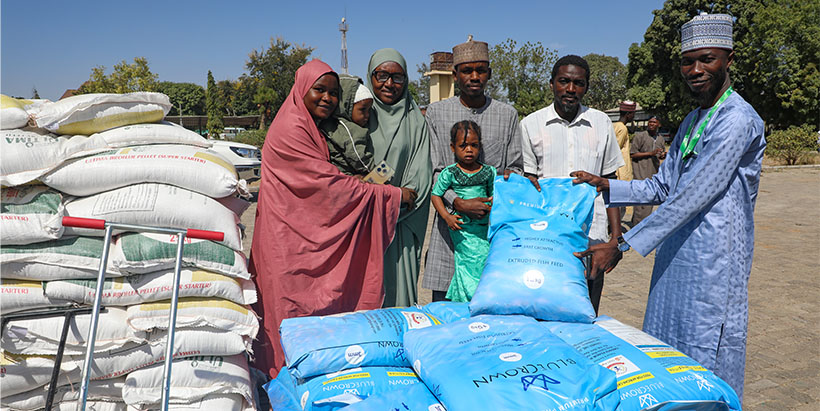 Bags of fish feed being presented to some fish farmers.