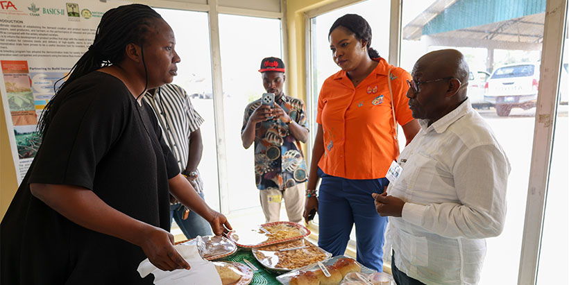 H.E Grange on a tour of IITA Cassava Processing Center to see products made with cassava.