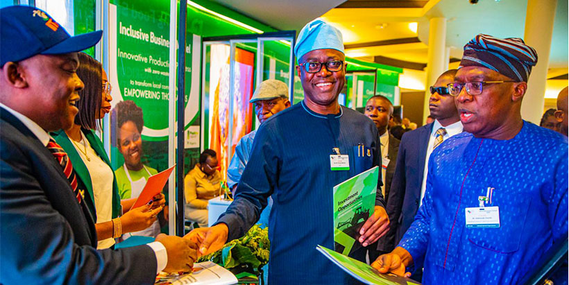 Oyo State Governor, H.E. Engineer Seyi Makinde with IITA Director of Private Sector Partnerships, Dr Debo Akande at the IITA Exhibition booth.