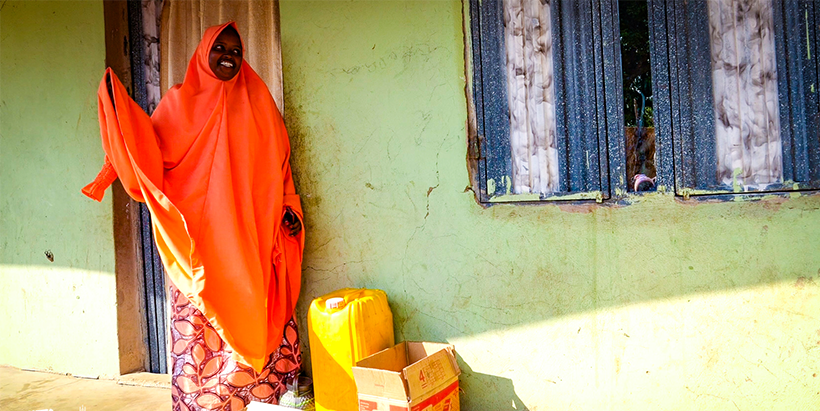 Zainab Aliyu in front of her house.
