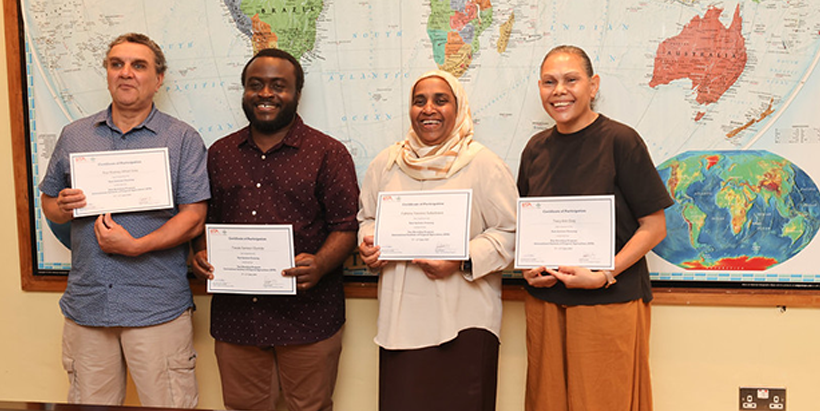 The Australian delegates heartily pose with their certificate of participation after the weeklong training.