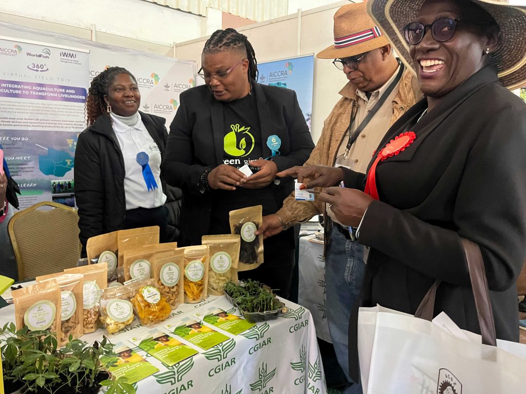 Visitors at the AICCRA booth during the Zambia agriculture and commercial show.