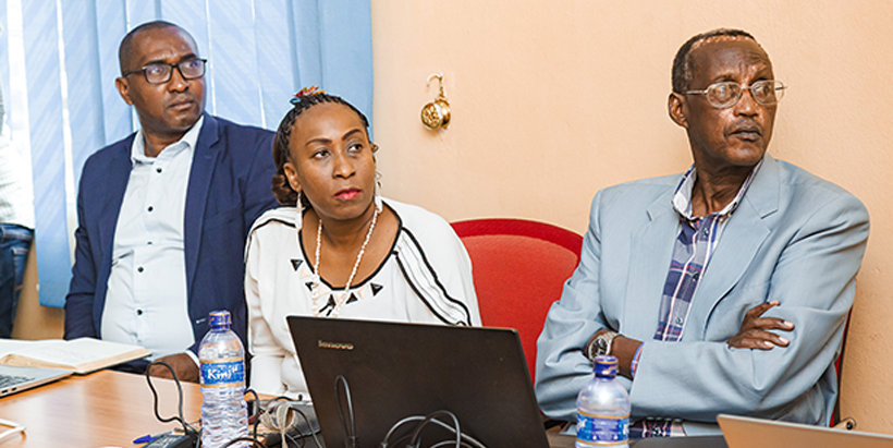 Government officials listening to a presentation on the IITA Youth in Agribusiness Office (IYA) approach to youth engagement in agribusiness.