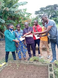 Photo: The CAR delegation trained on field transplanting of SAH cassava plantlets