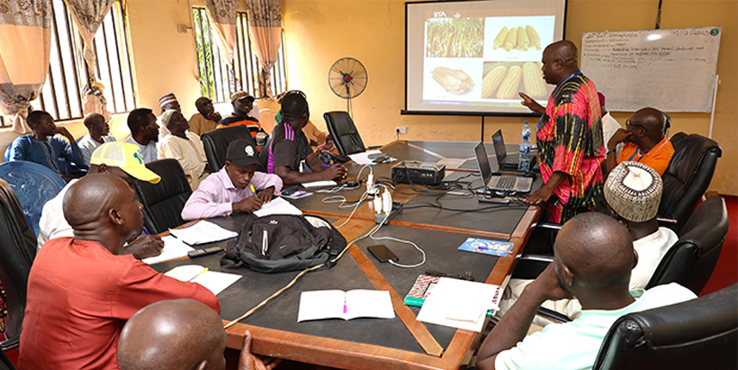 Reuben Solomon training farmers on Aflatoxin control in maize