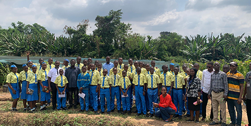 The IITA team with the students and teachers during a field visit